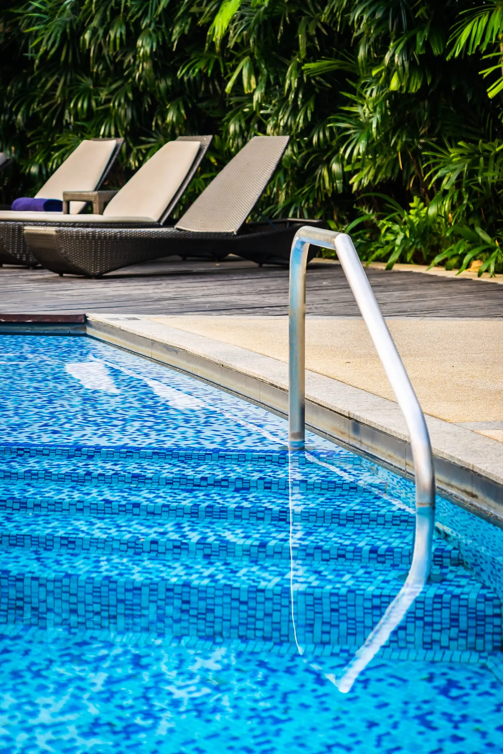 Well-maintained residential pool at dusk, serviced regularly under Cameron Facilities’ reliable pool services.