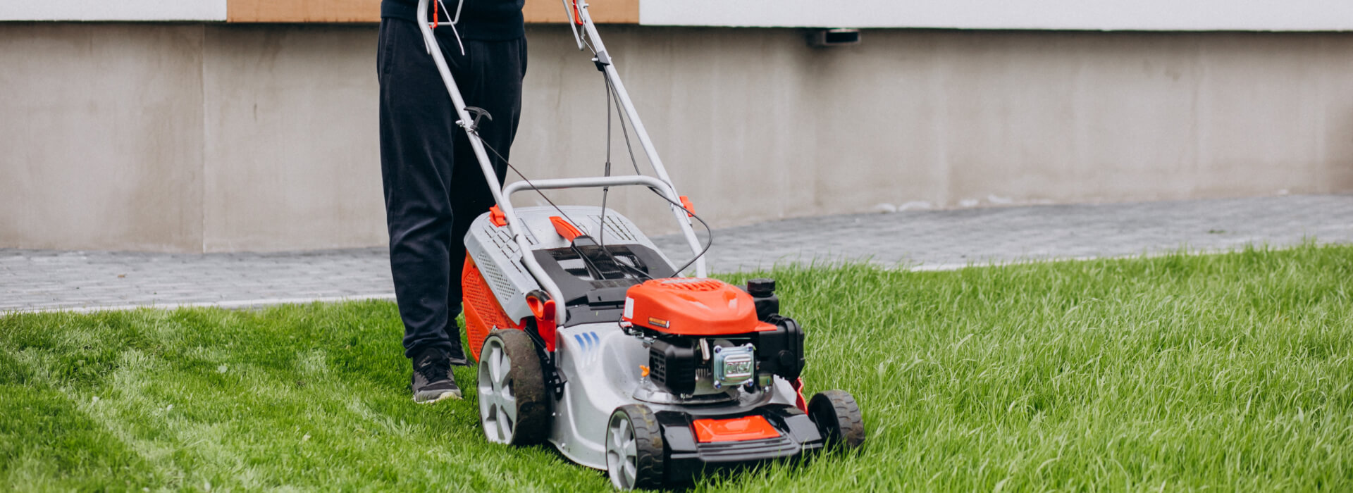 Landscaping crew maintaining garden beds and hedges on a Perth commercial property