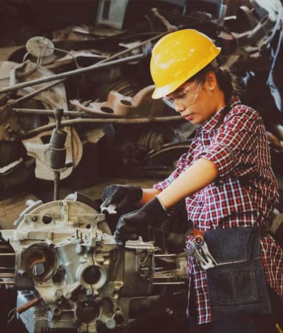 Building maintenance technician servicing mechanical building systems