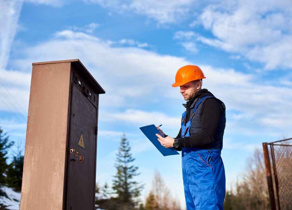Remote site facilities management by Cameron Facilities—technician maintaining camp infrastructure in regional WA